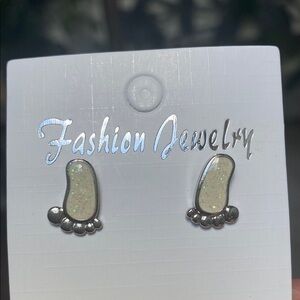Silver and White Footprint Earrings with specs of glitter.